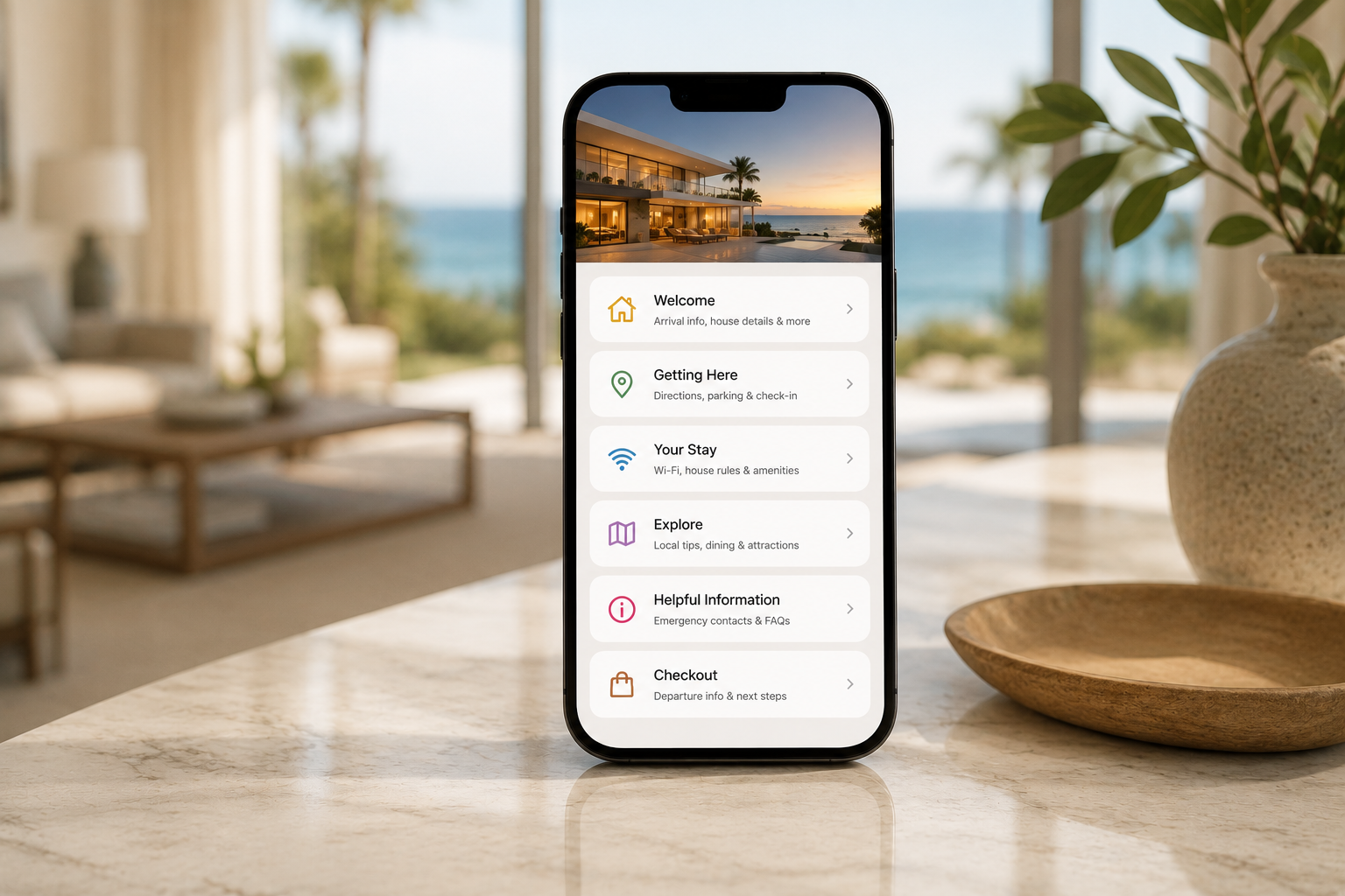 StayHub™ mobile portal shown on a phone in a modern beachfront living room